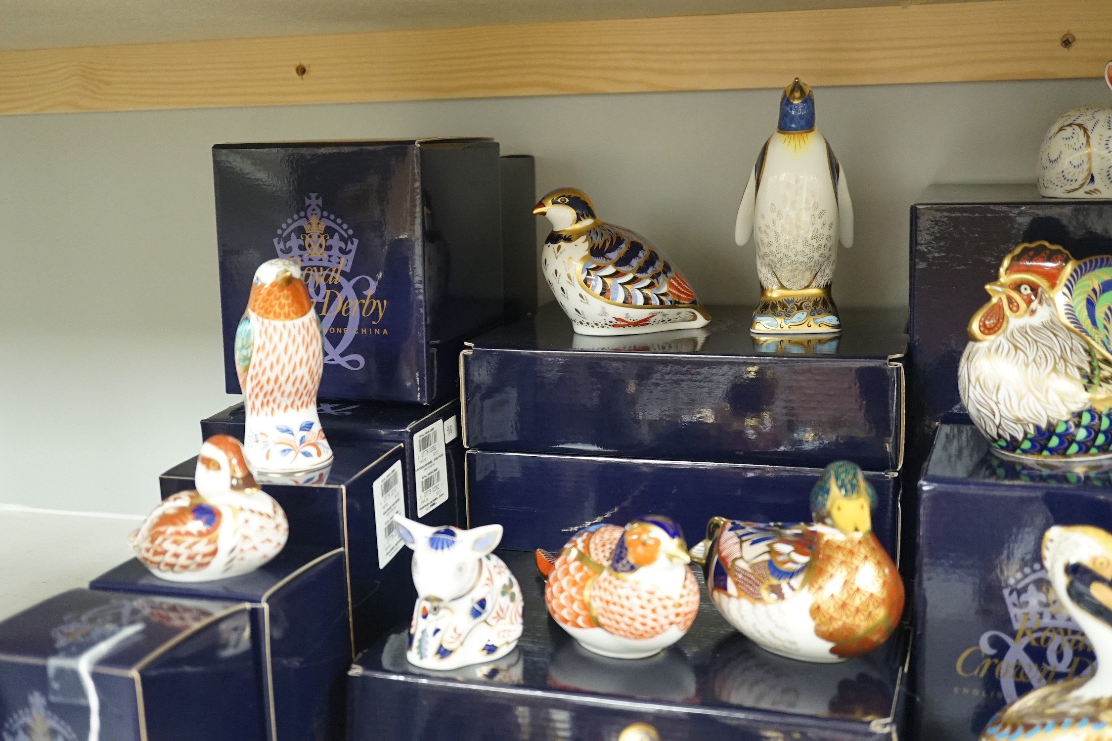 Approximately thirty-two Royal Crown Derby Imari porcelain paperweights, all but two with original boxes and mostly gold bottoms
